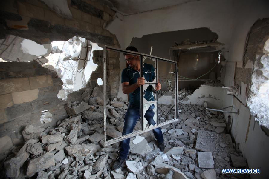 A Palestinian inspects the rubbles of the home of Bilal Abu Zaid after it was demolished by Israeli troops in the village of Qabatya near the West Bank city of Jenin, on July 18, 2016.