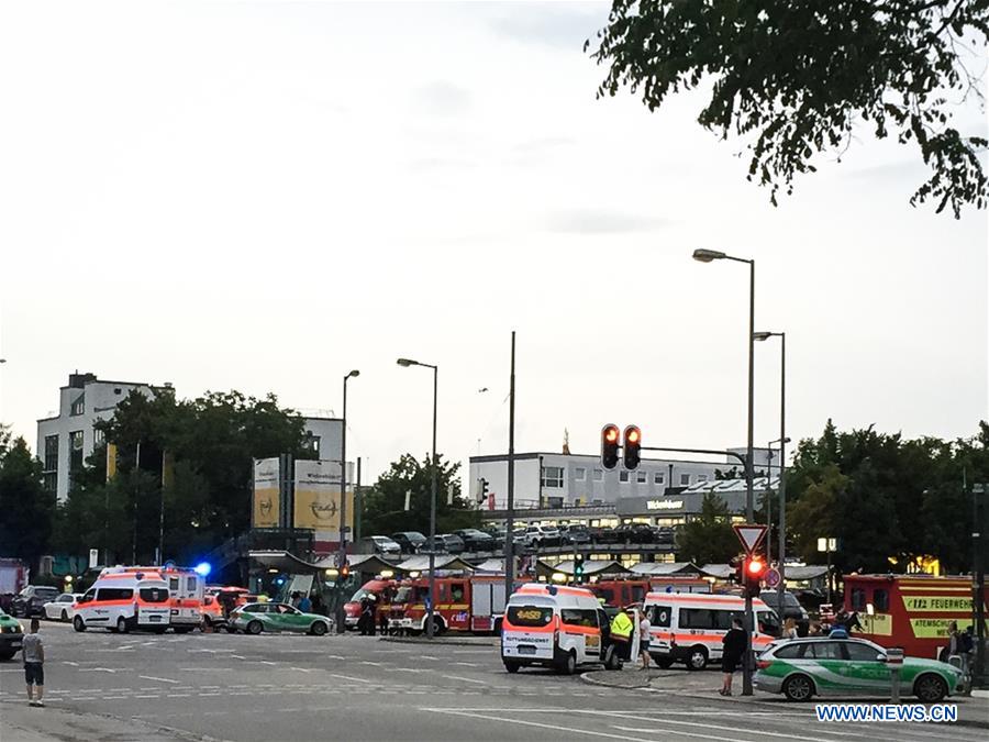 Photo taken by a mobile device shows police vehicles near the Munich's shopping mall where a shootout took place in Munich, Germany, on July 22, 2016.