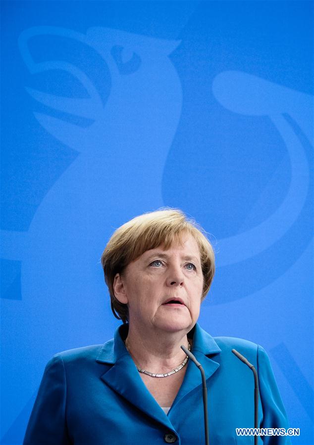 German Chancellor Angela Merkel arrives to attend a press conference in Berlin, capital of Germany, on July 23, 2016. 