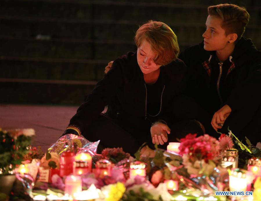 GERMANY-MUNICH-SHOOTOUT-MOURNING