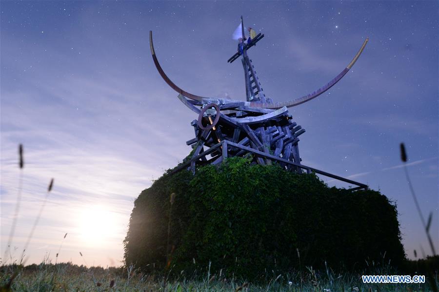 Art work 'Gilded Calf' is displayed during a landscape architecture festival called 'Archstoyanie' in Nikola-Lenivets, Russia, July 23, 2016.