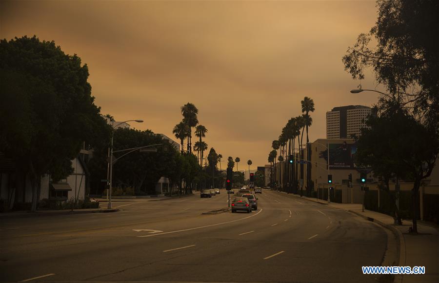 The city is wholly enveloped by smoke caused by wildfire in Los Angeles, the United States, on July 23, 2016. The city is wholly enveloped by smoke caused by wildfire in Los Angeles, the United States, on July 23, 2016.