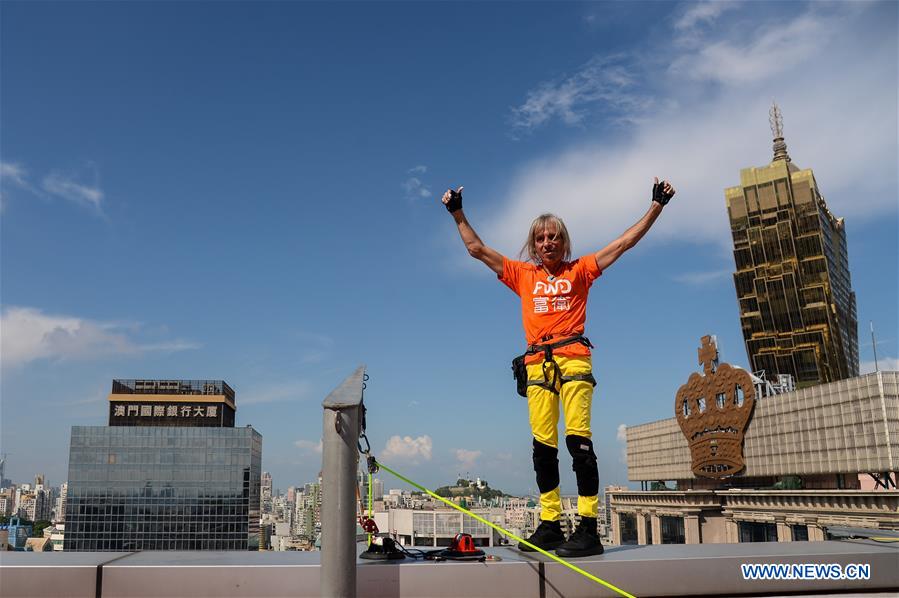 French urban climber Alain Robert dubbed Spiderman, scales the Fortuna Business Center in Macao, south China, July 26, 2016. French urban climber Alain Robert dubbed Spiderman, scales the Fortuna Business Center in Macao, south China, July 26, 2016.