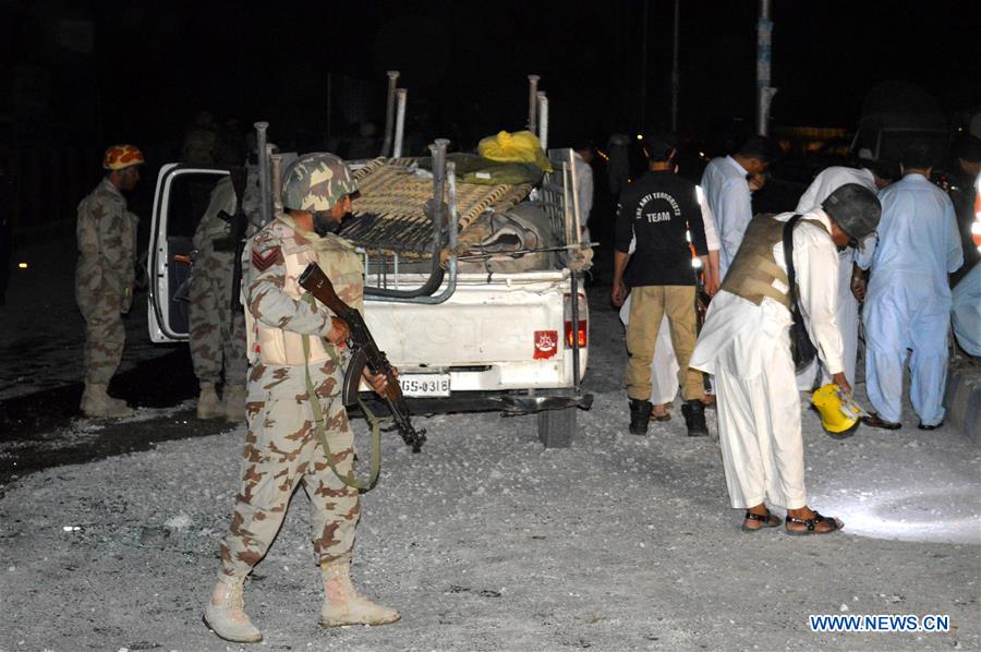 Security officials examine the blast site in southwest Pakistan's Quetta, on July 27, 2016. 