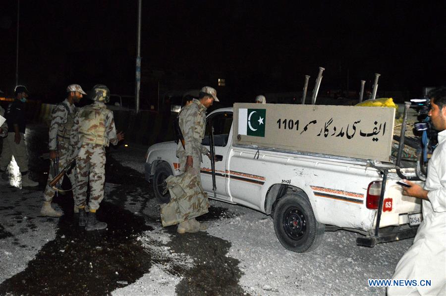 Security officials examine the blast site in southwest Pakistan's Quetta, on July 27, 2016. 