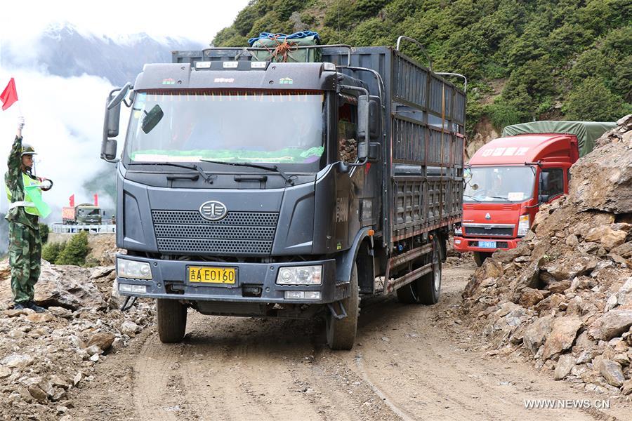 Traffic of the Juebashan section of Sichuan-Tibet highway, which was interrupted due to rain-triggered landslide, resumed Wednesday noon