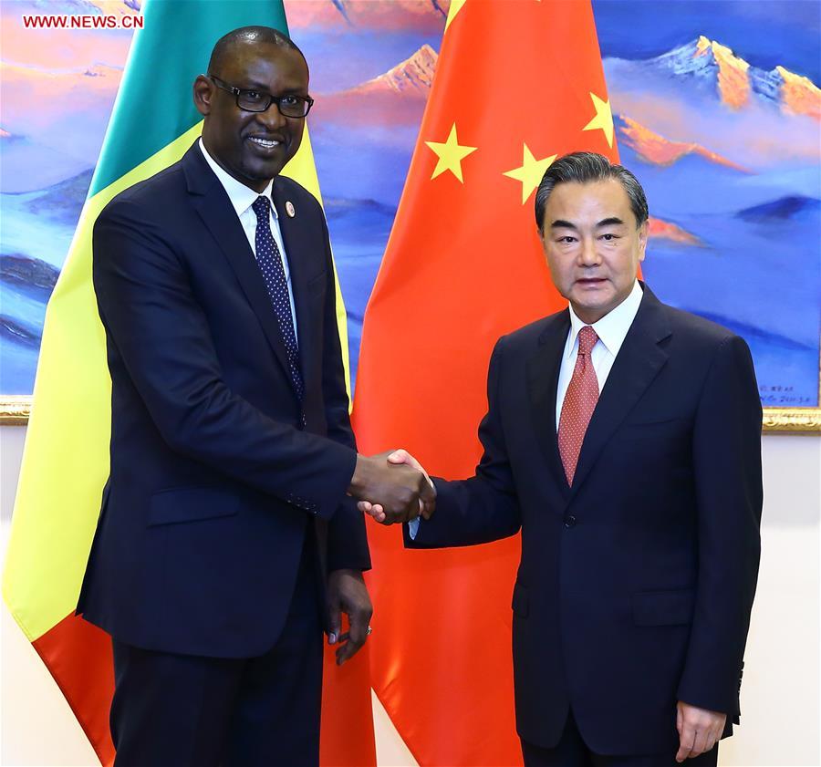 Chinese Foreign Minister Wang Yi (R) meets with Malian Foreign Minister Abdoulaye Diop, who came to attend a Sino-African coordinators' meeting on the implementation of actions resulting from the Forum on China-Africa Cooperation (FOCAC) held in Johannesburg of South Africa, in Beijing, capital of China, July 28, 2016. (Xinhua/Ding Haitao)