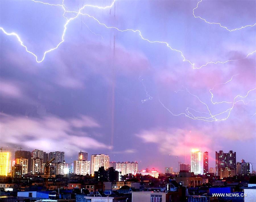 Photo taken on July 28, 2016 shows lightning over the city of Qinzhou, south China's Guangxi Zhuang Autonomous Region. (Xinhua/Huang Xiaobang) 