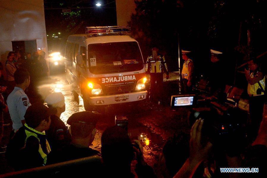 Police officers stand guard when an ambulance (not in frame) carrying the body of an executed prisoner leaves the port of Nusa Kambangan prison island in Cilacap, Central Java, Indonesia on July 29, 2016. Police officers stand guard when an ambulance (not in frame) carrying the body of an executed prisoner leaves the port of Nusa Kambangan prison island in Cilacap, Central Java, Indonesia on July 29, 2016.
