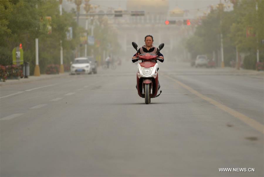 Many regions in Jiuquan were hit by a sand storm on Tuesday. (Xinhua/Chen Bin) 