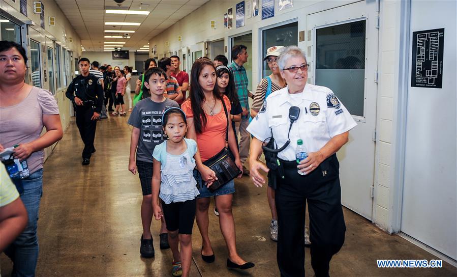 People take part in the 33rd 'National Night Out' program at the Alhambra Police Department in Los Angeles, the United States, Aug. 2, 2016. People take part in the 33rd 'National Night Out' program at the Alhambra Police Department in Los Angeles, the United States, Aug. 2, 2016.