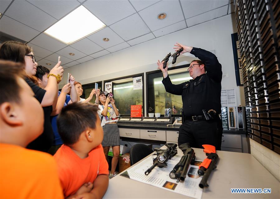 People take part in the 33rd 'National Night Out' program at the Alhambra Police Department in Los Angeles, the United States, Aug. 2, 2016. People take part in the 33rd 'National Night Out' program at the Alhambra Police Department in Los Angeles, the United States, Aug. 2, 2016.