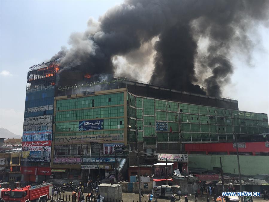 Photo taken on Aug. 4, 2016 shows the burning building in Kabul, capital of Afghanistan.