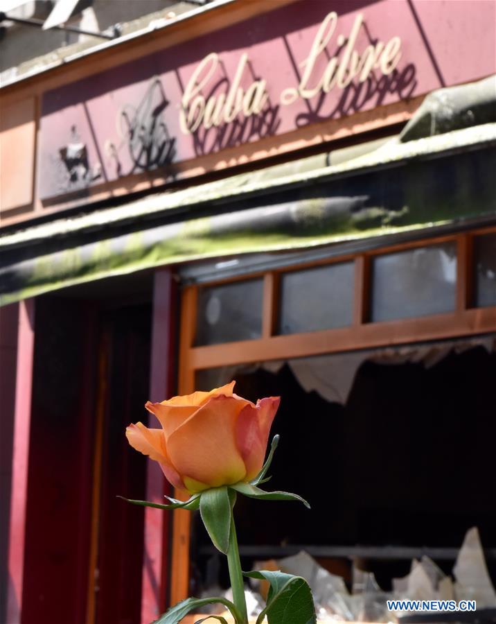 Policemen investigate the site of a bar fire in Rouen, France, on Aug. 6, 2016. 