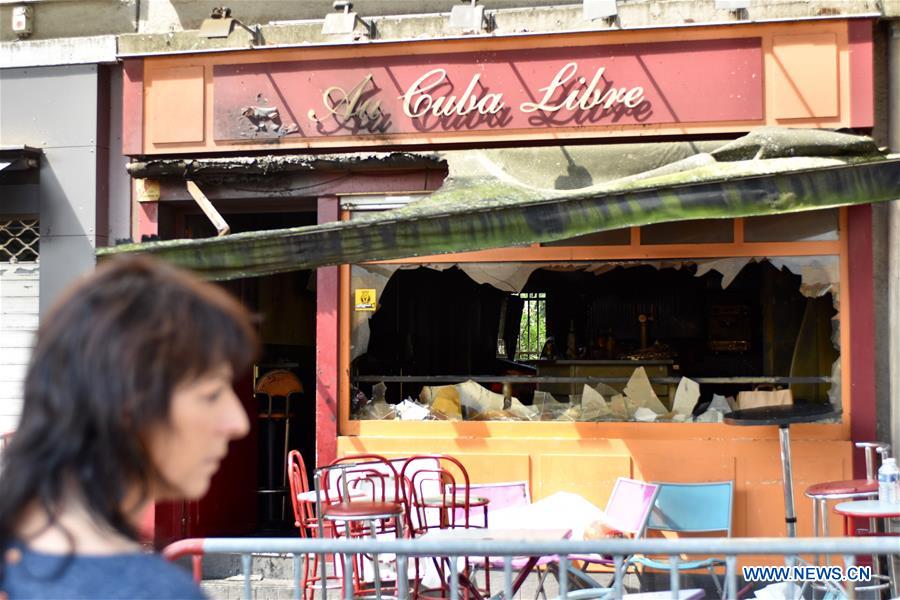 Policemen investigate the site of a bar fire in Rouen, France, on Aug. 6, 2016. Policemen investigate the site of a bar fire in Rouen, France, on Aug. 6, 2016.