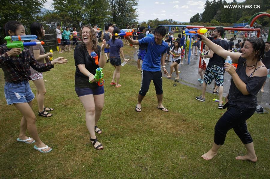People with water guns participate in Vancouver Water Fight event at Stanley Park in Vancouver, Canada, on Aug. 6, 2016. People with water guns participate in Vancouver Water Fight event at Stanley Park in Vancouver, Canada, on Aug. 6, 2016.