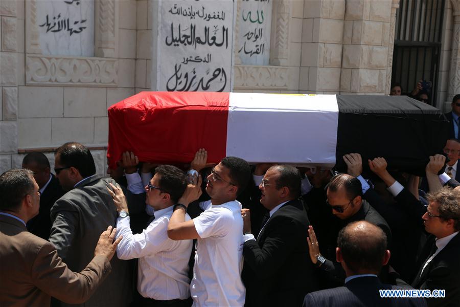 People carry Ahmed Zewail's coffin during a funeral in Cairo, Egypt, Aug. 7, 2016.