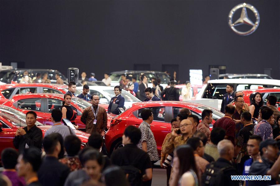 Visitors stand around vehicles during the GAIKINDO Indonesia International Auto Show (GIIAS) 2016 held in South Tangerang, Indonesia, on Aug. 11, 2016. 