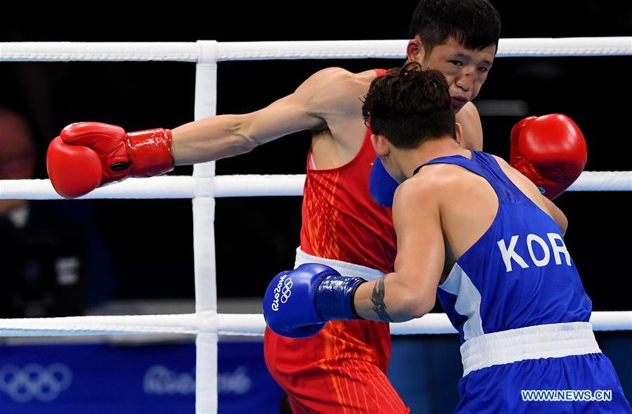 China's Zhang Jiawei (L) competes with South Korea's Ham Sangmyeong during the men's bantam(56KG) preliminary of boxing at the 2016 Rio Olympic Games in Rio de Janeiro, Brazil, on Aug. 14, 2016. China's Zhang Jiawei (L) competes with South Korea's Ham Sangmyeong during the men's bantam(56KG) preliminary of boxing at the 2016 Rio Olympic Games in Rio de Janeiro, Brazil, on Aug. 14, 2016.