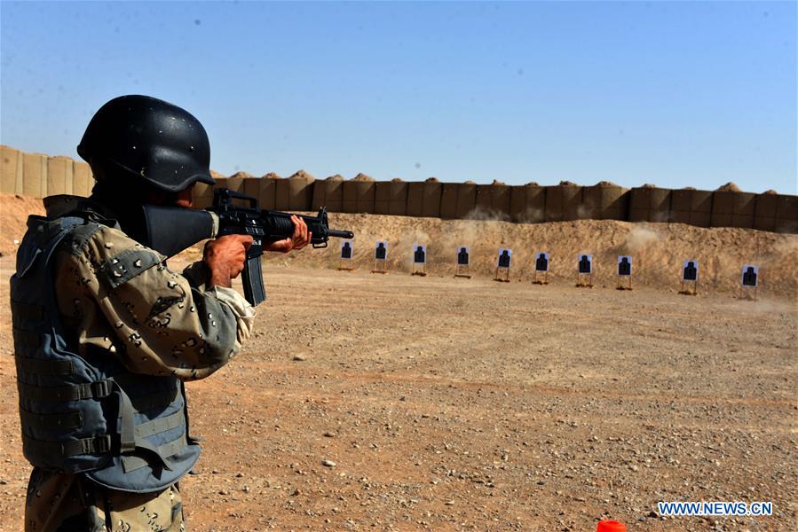 Afghan policemen take part in a military training at a training center in Kandahar province, southern Afghanistan, Aug. 23, 2016.