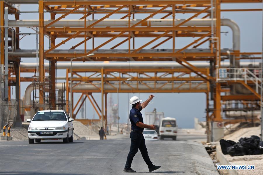 An Iranian staff member works at South Pars gas field near the southern Iranian port of Assalouyeh, Iran, Aug. 23, 2016.