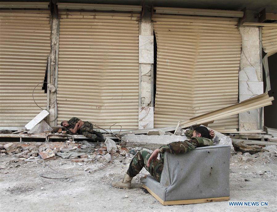 SYRIA-DARAYA-REBELS' EVACUATION-SYRIAN SOLDIERS-FEATURE