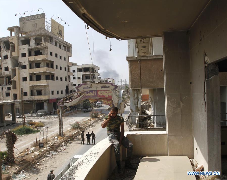 SYRIA-DARAYA-REBELS' EVACUATION-SYRIAN SOLDIERS-FEATURE