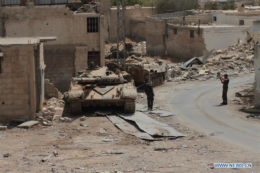 SYRIA-DARAYA-REBELS' EVACUATION-SYRIAN SOLDIERS-FEATURE