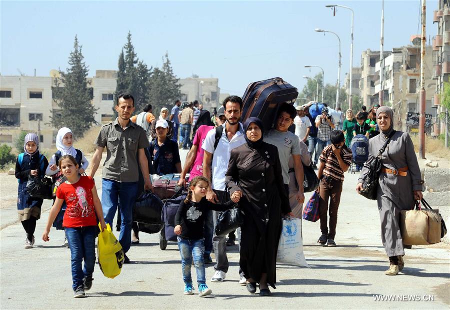 SYRIA-DAMASCUS-CIVILIANS-EVACUATE-REBEL-HELD-TOWN