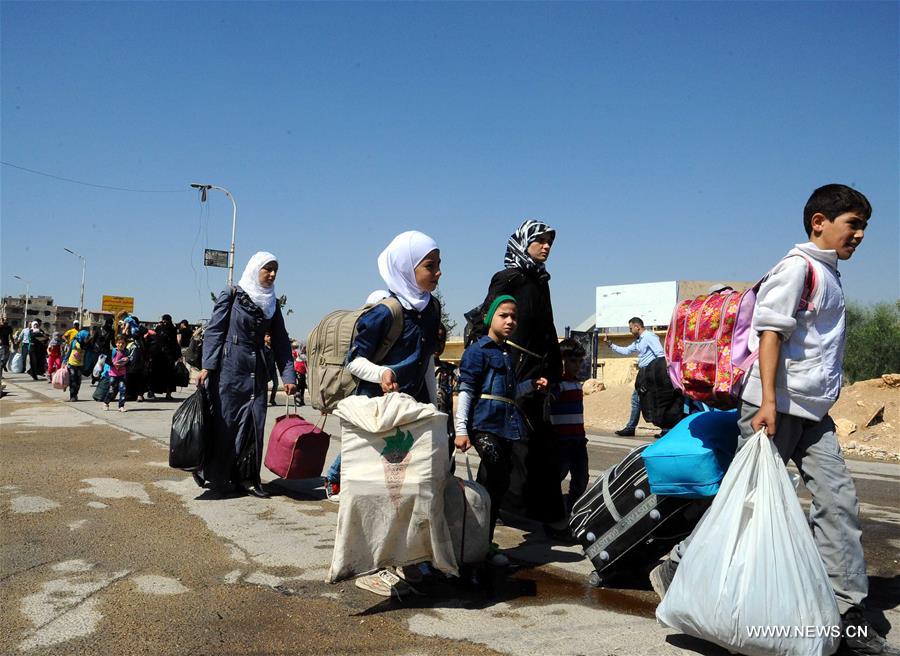 SYRIA-DAMASCUS-CIVILIANS-EVACUATE-REBEL-HELD-TOWN