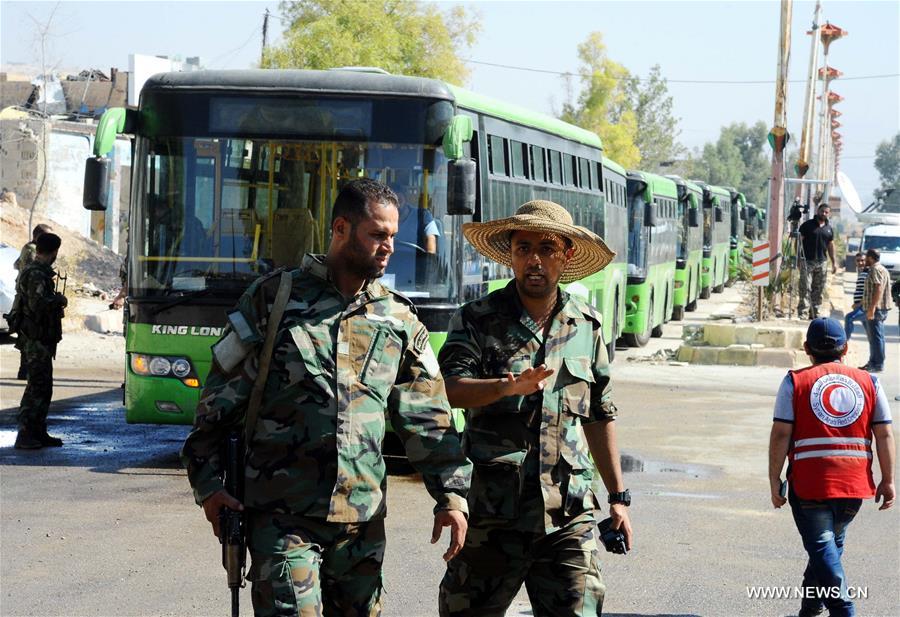 SYRIA-DAMASCUS-CIVILIANS-EVACUATE-REBEL-HELD-TOWN