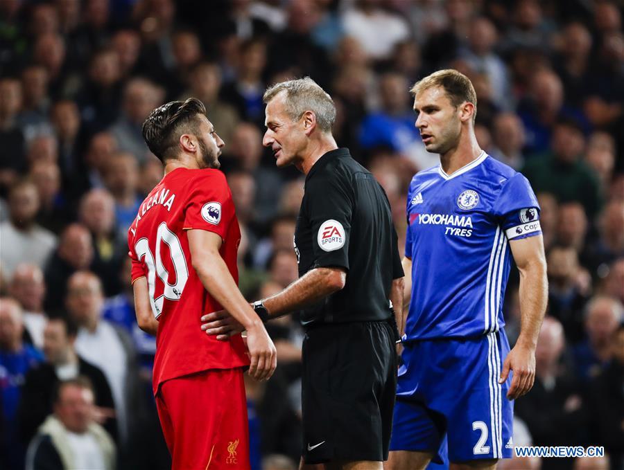 Adam Lallana (L) of Liverpool argues with Branislav Ivanovic (R) of Chelsea during their English Premier League match in London, Britain, on Sept. 16, 2016. Liverpool won 2-1.