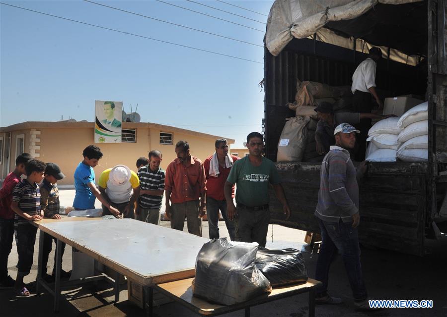 SYRIA-DAMASCUS-AID-DELIVERY-DISPLACED