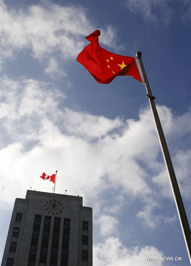 About 300 Canadian-Chinese from local communities together with local government officials participated in the Chinese national flag raising ceremony to celebrate the 67th anniversary of the founding of the People's Republic of China here on Friday. 