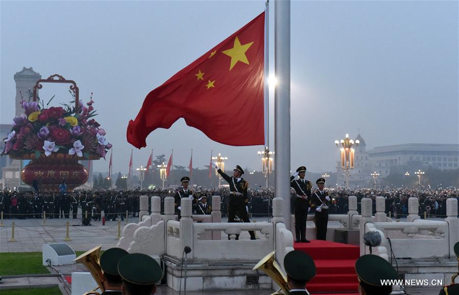 Over 100,000 people from across the country gathered at the Tian'anmen Square to watch the national flag-raising ceremony on the morning of Oct. 1, marking the 67th anniversary of the founding of the People's Republic of China. Over 100,000 people from across the country gathered at the Tian'anmen Square to watch the national flag-raising ceremony on the morning of Oct. 1, marking the 67th anniversary of the founding of the People's Republic of China.