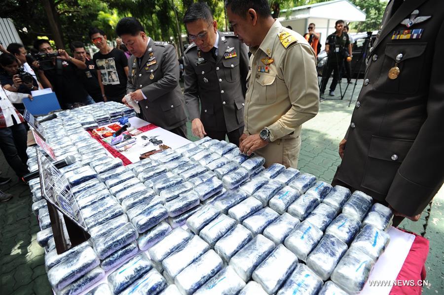 Thai police officers display a total of one million amphetamine tablets seized in Ayutthaya Province during a press briefing in Bangkok, Thailand, Oct. 3, 2016.