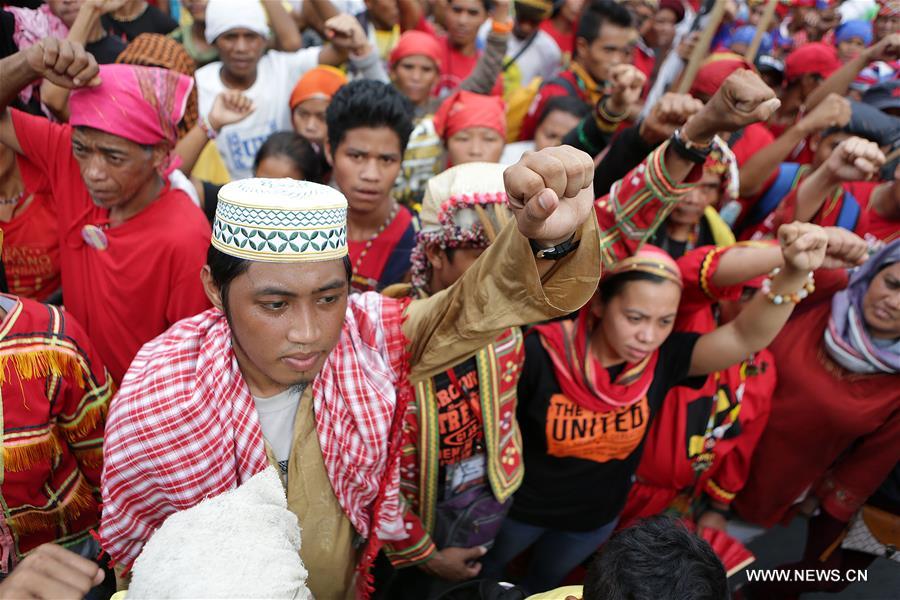 Indigenous people called Sandugo shout slogans during their protest rally in support of Philippine President Rodrigo Duterte's foreign policy near the U.S. Embassy in Manila, the Philippines, Oct. 27, 2016. Indigenous people called Sandugo shout slogans during their protest rally in support of Philippine President Rodrigo Duterte's foreign policy near the U.S. Embassy in Manila, the Philippines, Oct. 27, 2016.