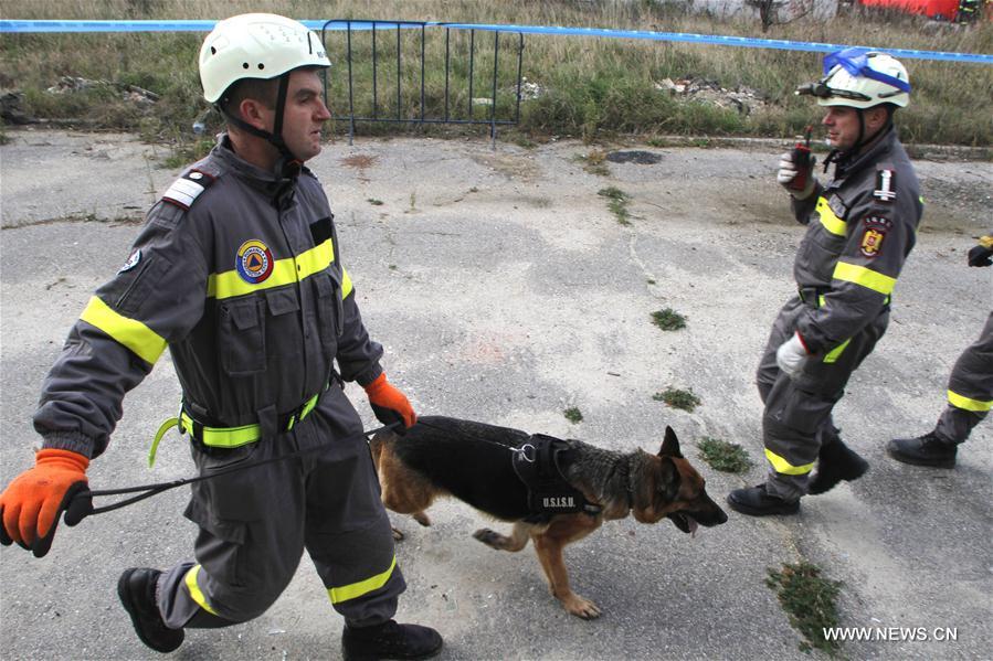 Firefighters and medical emergency staff take part in a rescue operation during an earthquake exercise held in Bucharest, Romania, Nov. 1, 2016.