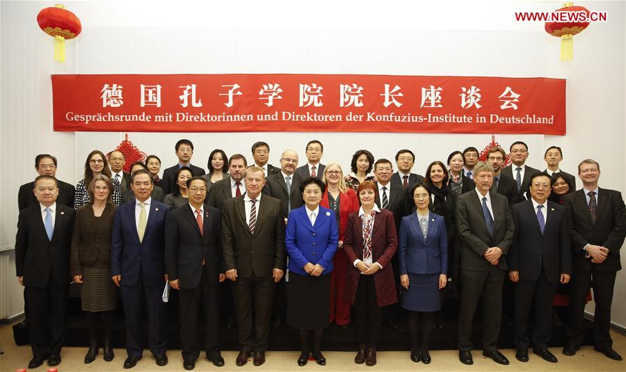Chinese Vice Premier Liu Yandong (6th L Front) poses for a photo with some directors and teachers of German Confucius Institutes at the Free University of Berlin, Germany, Nov. 25, 2016. Chinese Vice Premier Liu Yandong on Friday called for better use of Confucius Institutes to promote exchanges and mutual learning among different civilizations and enhance people's understanding about China when visiting the Confucius Institute at the Free University of Berlin. (Xinhua/Ye Pingfan)
