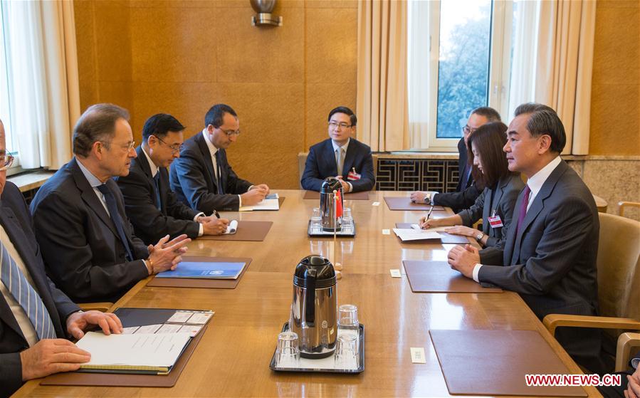 Chinese Foreign Minister Wang Yi (1st R) meets with the Director-General of the United Nations Office at Geneva (UNOG), Michael Moller (2nd L), in Geneve, Switzerland, Dec. 11, 2016. (Xinhua/Xu Jinquan)
