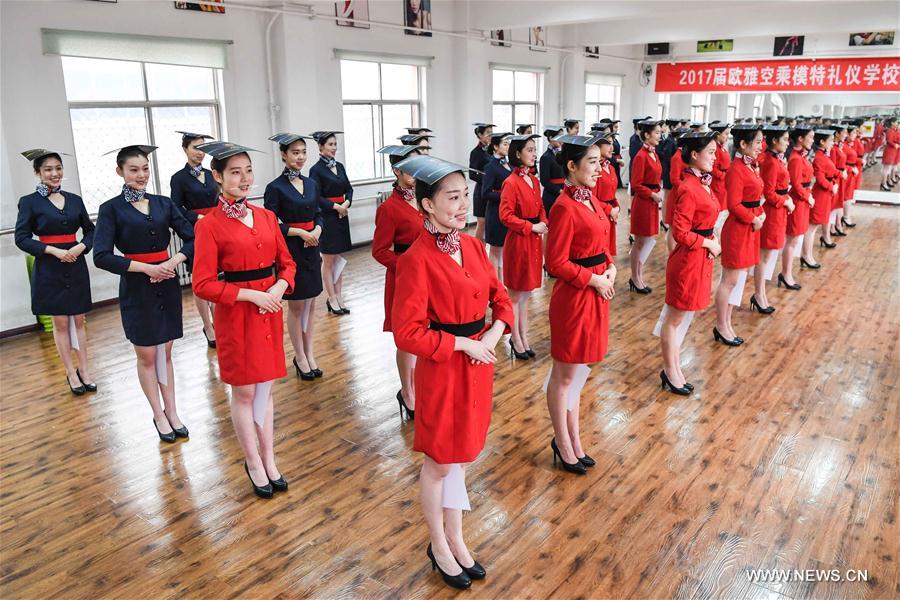 Students attend a stewardess skill training for the upcoming 2017 entrance examination for art majors in colleges in Luoyang, central China's Henan Province, Jan. 4, 2017.