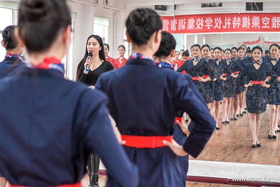 Students attend a stewardess skill training for the upcoming 2017 entrance examination for art majors in colleges in Luoyang, central China's Henan Province, Jan. 4, 2017.