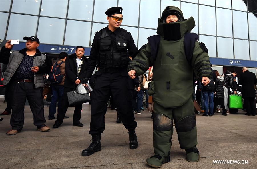 A SWAT member shows his skills during an open day event held by local railroad police at Wuhan Railway Station, central China's Hubei Province, Jan. 4, 2017.