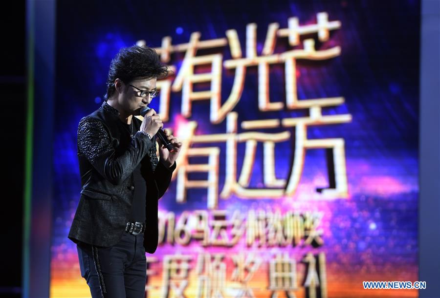 Rock singer Wang Feng performs during the awarding ceremony of the Jack Ma Rural Teachers Award in Sanya, a tourism resort in south China's Hainan Province, on Jan. 5, 2017. The awarding ceremony was held on Thursday, with 100 rural teachers winning the award of 100,000 yuan (14,522 U.S. dollars) respectively. (Xinhua/Yang Guanyu) 