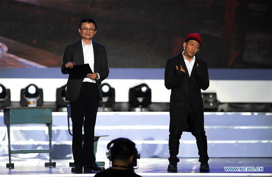 Jack Ma (L) performs a short play during the awarding ceremony of the Jack Ma Rural Teachers Award in Sanya, a tourism resort in south China's Hainan Province, on Jan. 5, 2017. The event was held on Thursday, with 100 rural teachers winning the award of 100,000 yuan (14,522 U.S. dollars) respectively. (Xinhua/Yang Guanyu) 