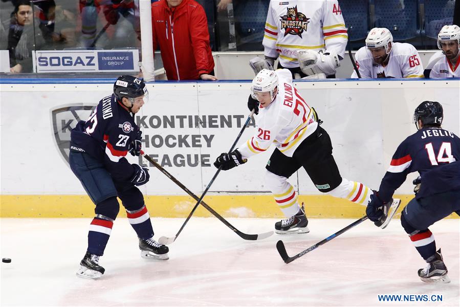 Jonas Enlund (C) of Beijing Kunlun Redstar vies with Nick Plastino (L) and Ziga Jeglic of HC Slovan Bratislava during the Kontinental Hockey League (KHL) match between HC Slovan Bratislava and Beijing Kunlun Redstar in Bratislava, Slovakia, on Jan.5, 2017. Beijing Kunlun Redstar won 2-1. (Xinhua/Andrej Klizan) Jonas Enlund (C) of Beijing Kunlun Redstar vies with Nick Plastino (L) and Ziga Jeglic of HC Slovan Bratislava during the Kontinental Hockey League (KHL) match between HC Slovan Bratislava and Beijing Kunlun Redstar in Bratislava, Slovakia, on Jan.5, 2017. Beijing Kunlun Redstar won 2-1. (Xinhua/Andrej Klizan)
