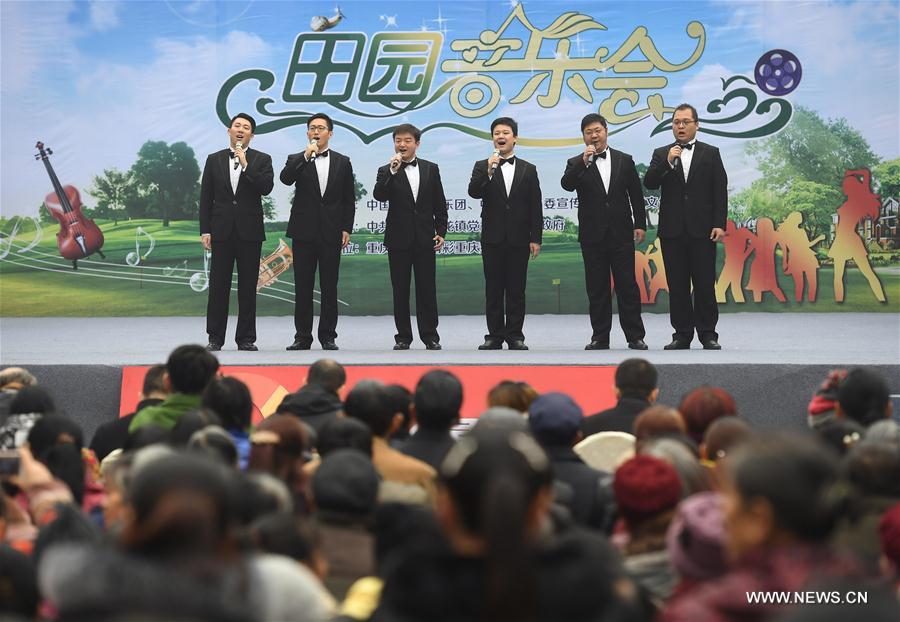 About 100 members of China National Symphony Orchestra visited the village and performed with the local band. 