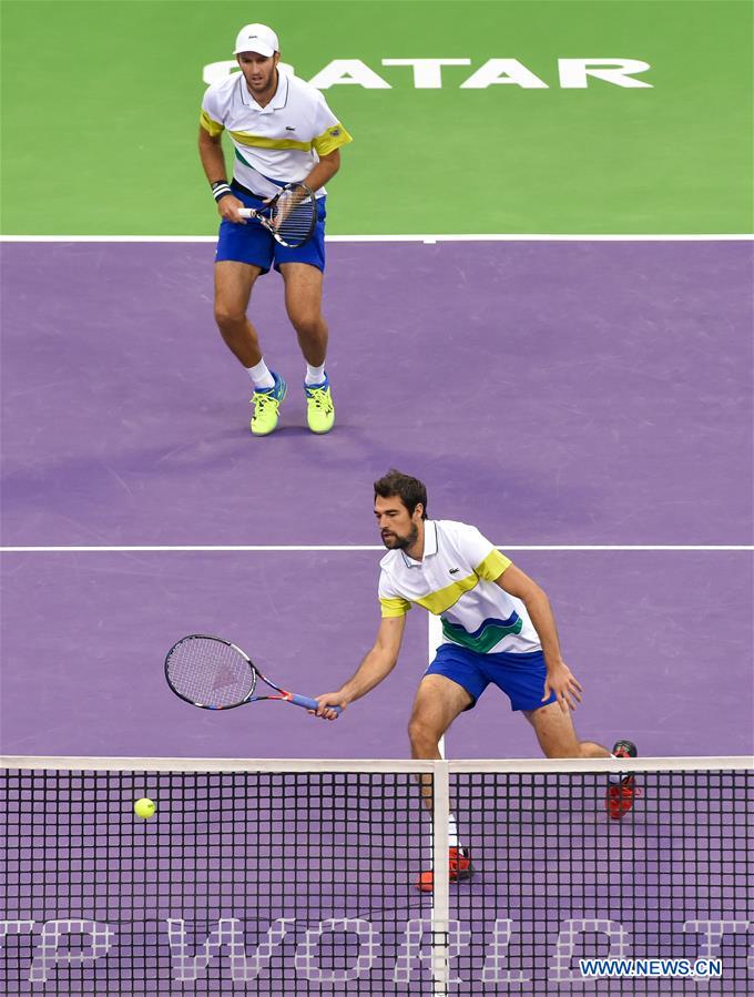 Jeremy Chardy (R) and Fabrice Martin of France compete with Vasek Pospisil of Canada and Radek Stepanek of the Czech Republic during the ATP Qatar Open tennis tournament doubles final match at the Khalifa International Tennis Complex in Doha, capital of Qatar on Jan. 6, 2017. Jeremy Chardy and Fabrice Martin claimed the title with 2-0. (Xinhua/Nikku) 