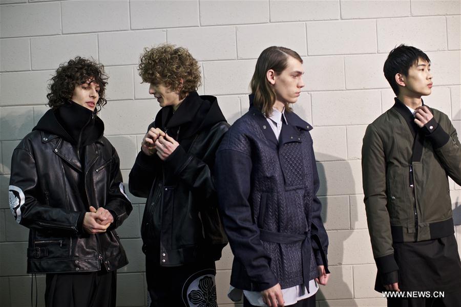 Models present creations of Diesel Black Gold men's Fall-Winter 2017-2018 collection during Milan Fashion Week in Milan, Italy, on Jan. 14, 2017. 