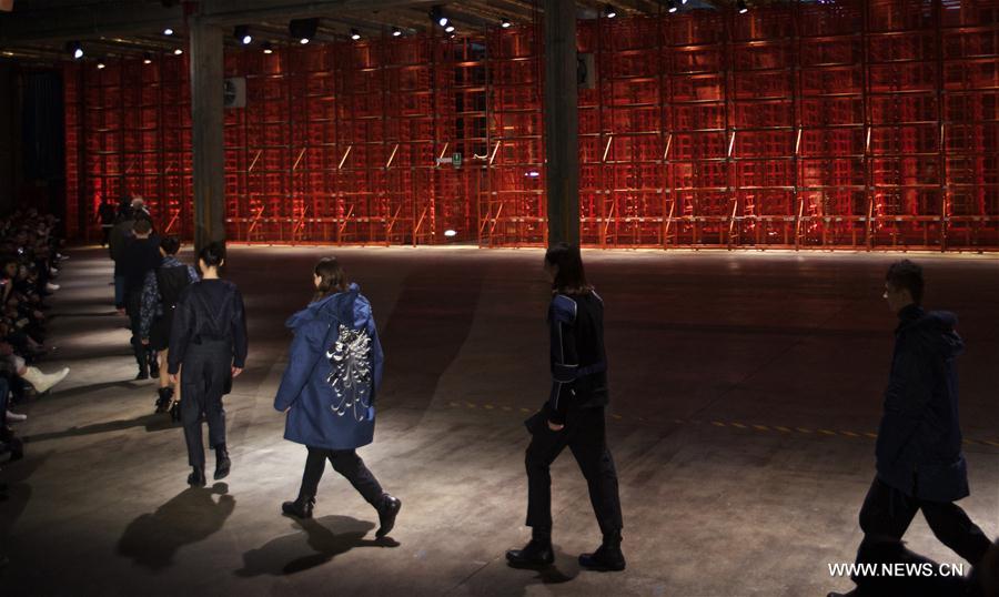 Models present creations of Diesel Black Gold men's Fall-Winter 2017-2018 collection during Milan Fashion Week in Milan, Italy, on Jan. 14, 2017. 
